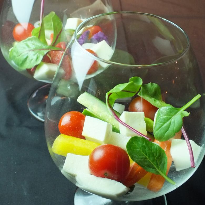 Caprese style of colorful vegetables and cheese