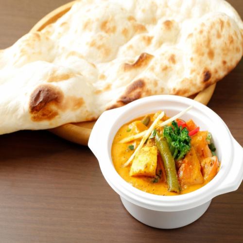 With vegetable curry naan or rice