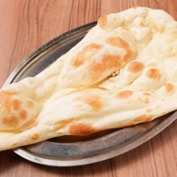 Naan baked in an authentic tandoor oven