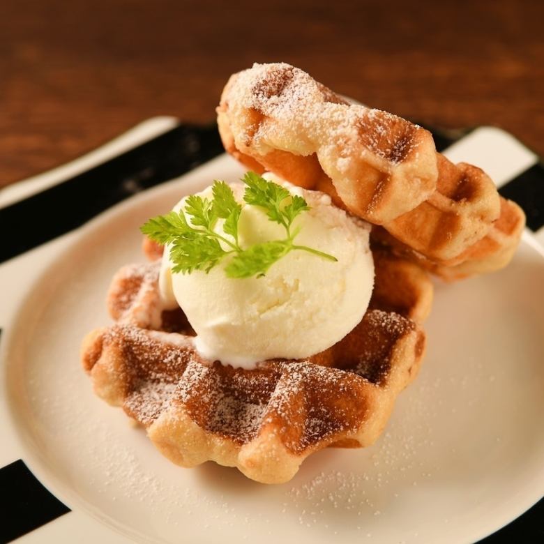 Waffle with ice cream and whipped cream