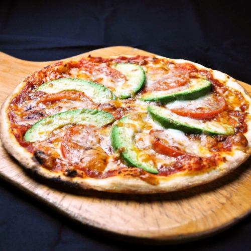 Fresh tomato and avocado pizza