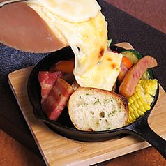 We have raclette, our proud stone oven pizza, and sake that goes well with it.