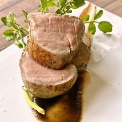 Low-temperature cooked pork tenderloin with charred onion sauce
