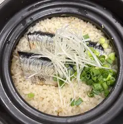 Fresh Pacific saury rice cooked in an earthenware pot
