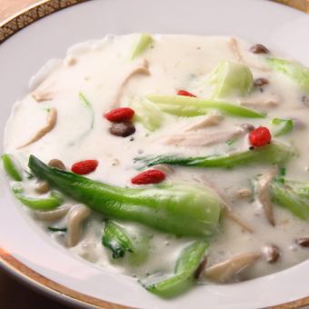 Boiled mushrooms and bok choy in cream sauce