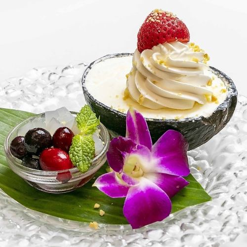 Seasonal fruits and coconut ice cream in a coconut bowl