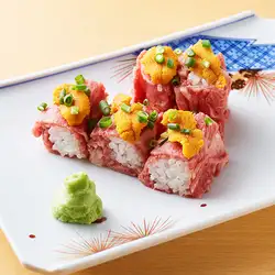 Seared fillet sushi topped with fresh sea urchin