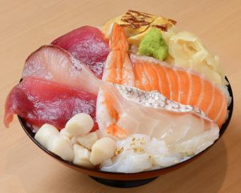 Bowl of rice topped with sashimi