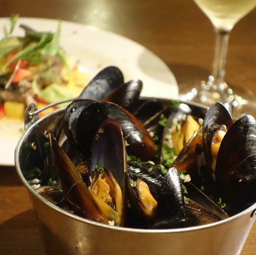 Large bucket of mussels steamed in white wine Garlic and butter temptation