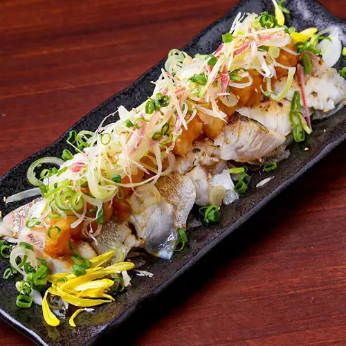 Seared fresh fish with condiments and ponzu sauce