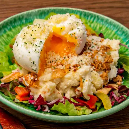 Soft-boiled egg on potato salad