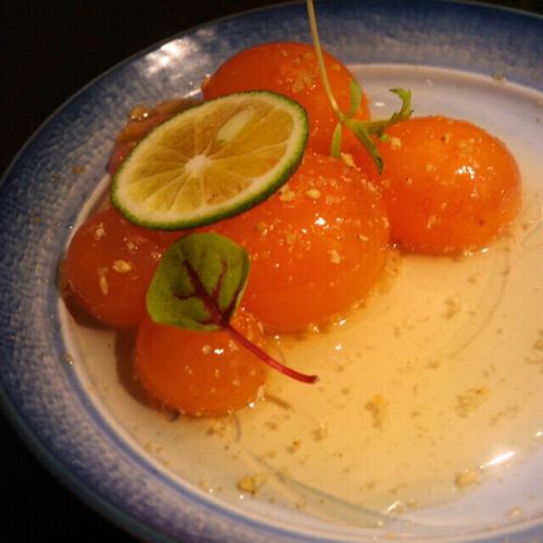 Kumquat sashimi is slowly marinated in soy sauce.
