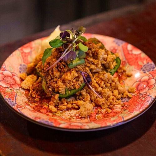 Raw Beeman stuffed with meat and topped with red delicious apples.