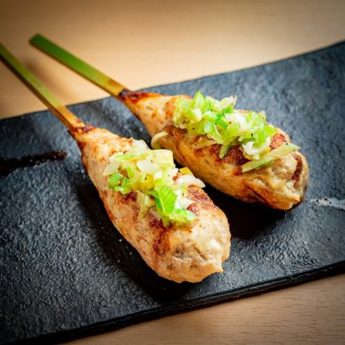 Raw meatballs and green onions