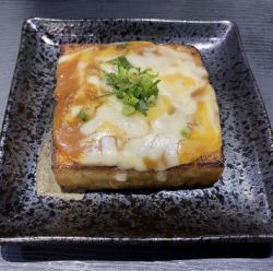 Deep-fried tofu baked with gooey miso and cheese.