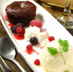 Petit fondant chocolate and milk ice berry sauce