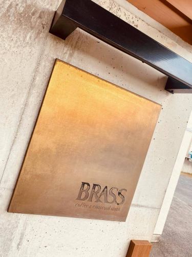 A well-worn entrance sign
#brass #MitoRestaurant #BirthdayPlate Mito #MitoSteak #MitoYakiniku