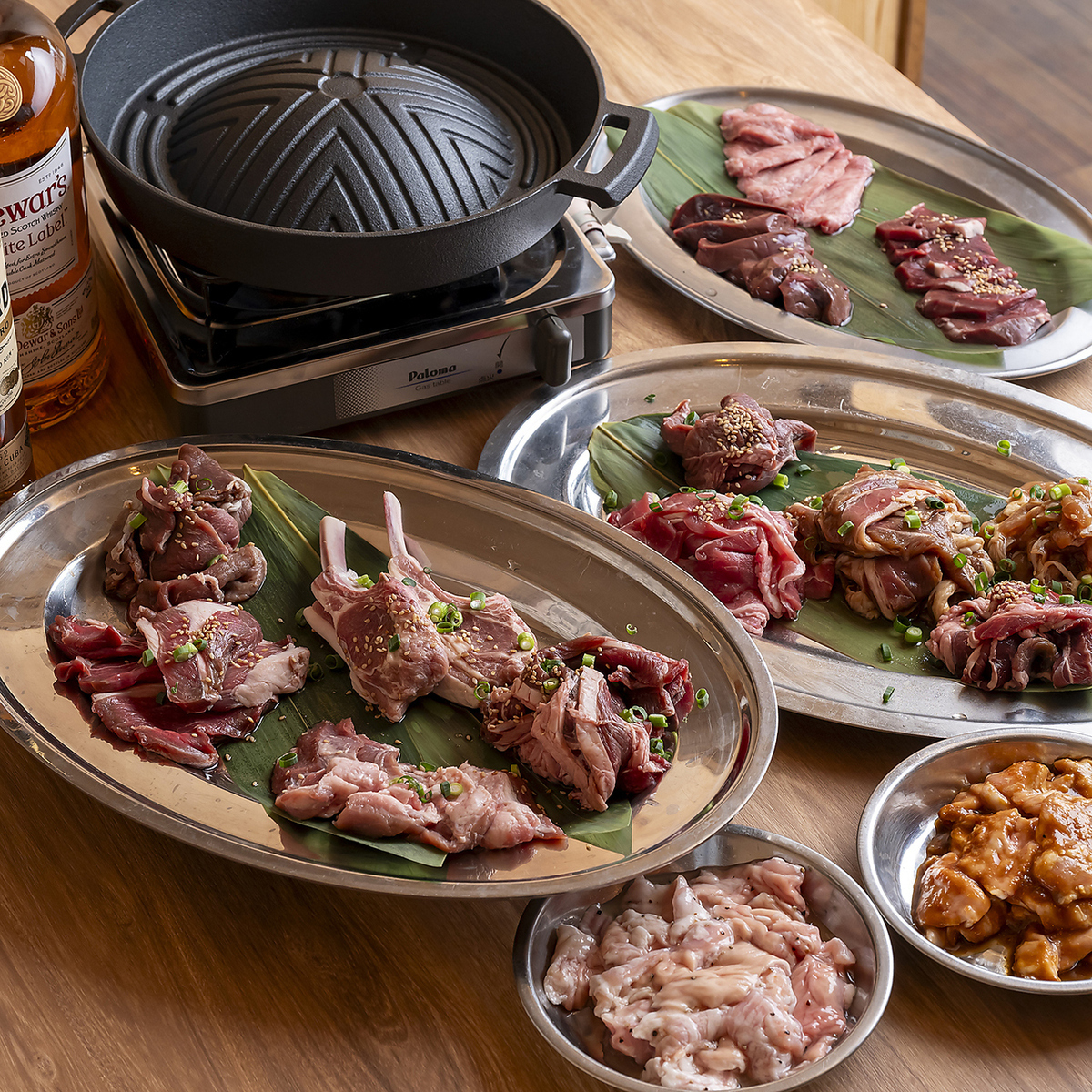 A selection of 14 dishes including various types of Genghis Khan (grilled lamb) and offal.