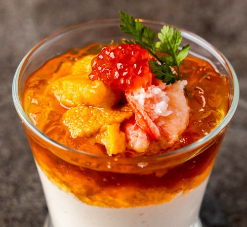 Seasonal mousse with sea urchin, crab, and salmon roe, served with lobster jelly.