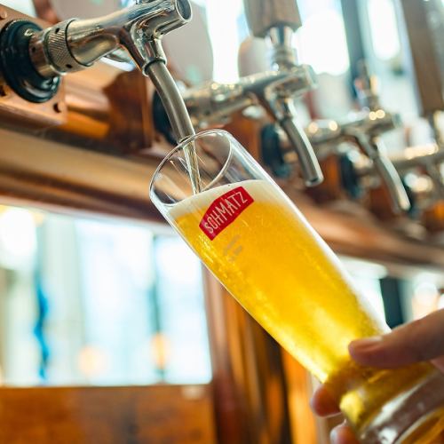 Beer tenders serve freshly poured beer