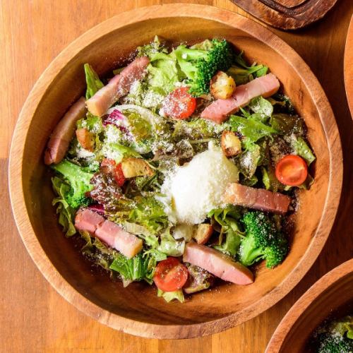 Caesar salad with thick-sliced bacon and soft-boiled eggs