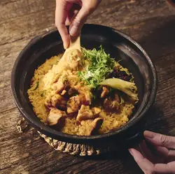 Clay pot rice with Shiretoko chicken, Kujo leeks, and fresh ginger