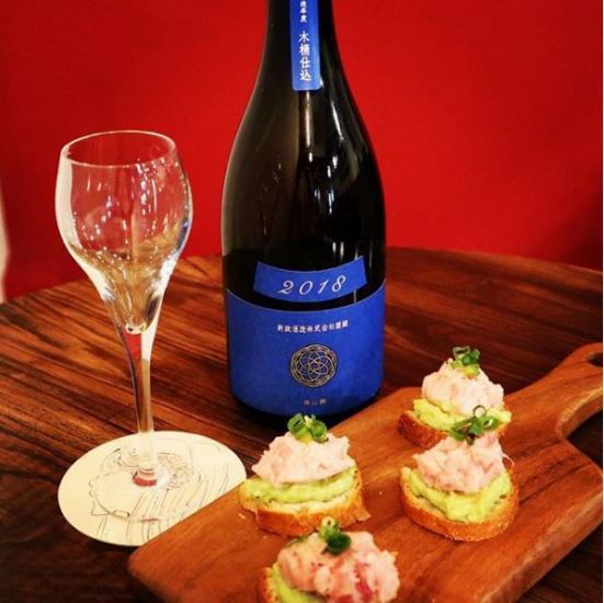 A stylish toast of special dishes and sake in a wine glass ☆