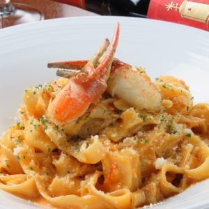 Snow crab and scallops in tomato cream fettuccine