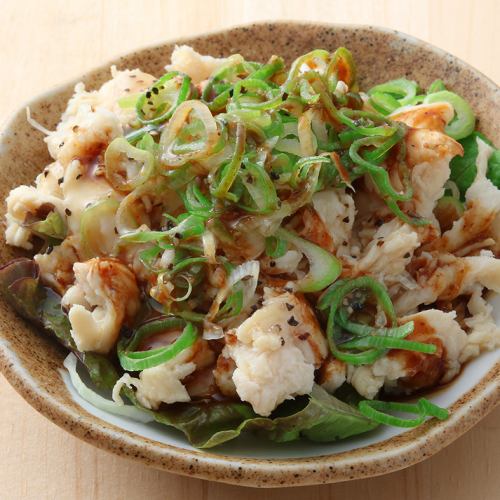 Steamed chicken covered in green onions