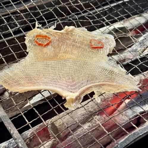 Charcoal grilled ray fin