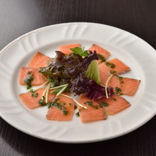 Salmon carpaccio with lemon dressing