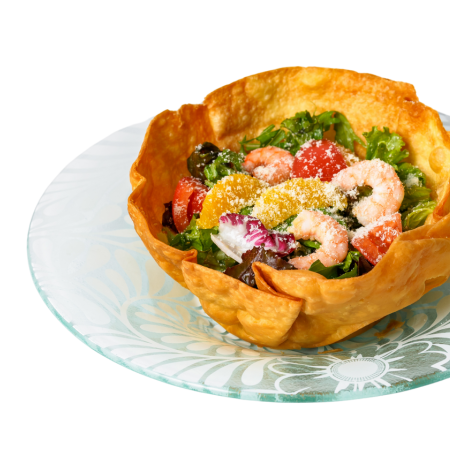 Shrimp and colorful vegetable tortilla salad with avocado dressing