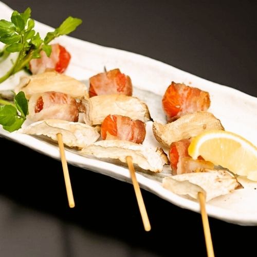 Skewers of eringi and meat-wrapped petit tomato