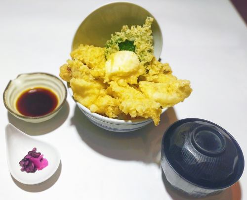 White fish tempura rice bowl topped with soft-boiled egg tempura