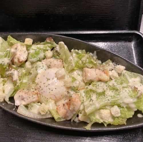 Caesar salad with hot egg and broiled chicken