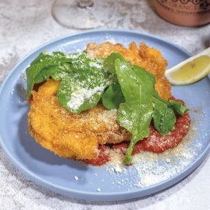 Chicken Milanese cutlet with arugula salad