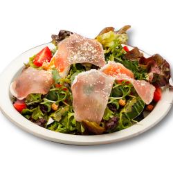 Caesar salad with raw ham and warm egg