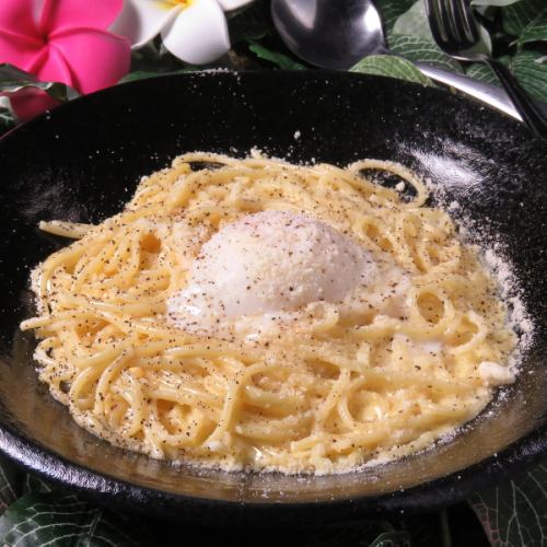 Fresh pasta carbonara served with a soft-boiled egg