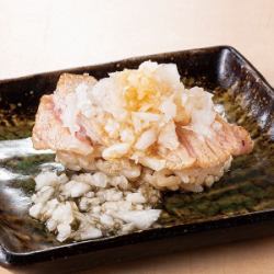 Fatty tuna steak covered in grated daikon radish