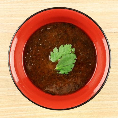 Green lettuce and red miso soup