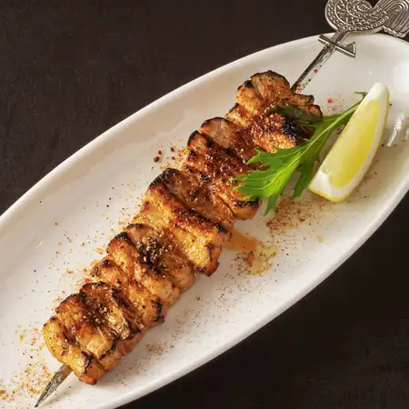 Peruvian-style spicy pork belly skewers (South American style)