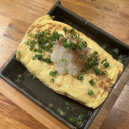 Dashi-rolled omelet made on an iron plate