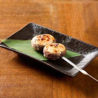 Shiitake mushroom skewers stuffed with meat