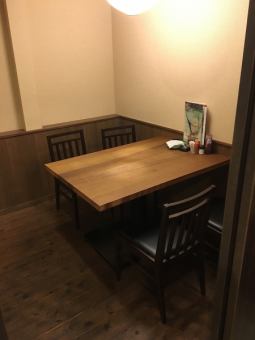 It is a semi-private room with a table for 4 people.