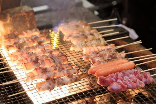 Grilled skewer with charcoal fire