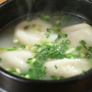 Boiled gyoza dumplings in gravy