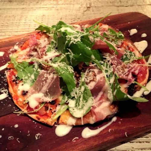 Parma ham and baby leaf pizza
