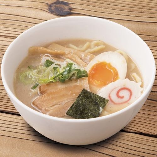 Finishing seafood tonkotsu soy sauce ramen