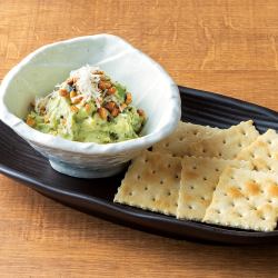 Avocado and basil green potato salad with crackers.