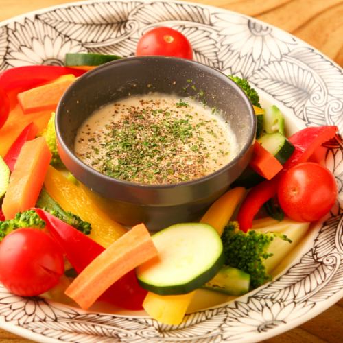 Bagna cauda with colorful vegetables and homemade anchovy sauce